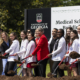 Founding Dean of the School of Medicine Shelley Nuss, middle, poses for photos and turns dirt with current medical students at the groundbreaking ceremony for UGA’s Medical Education and Research Building in Athens on April 19, 2024.
