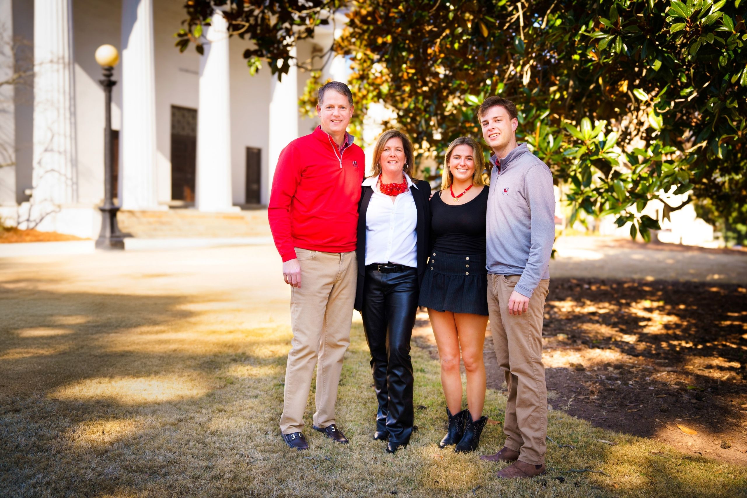 Newly named co-chairs of the UGA Parents Leadership Council (PLC) Stephanie (BSFCS ’94) and Fielder Shurling pose with their children Calder ‘28 and Hunt ‘26 in front of the UGA Chapel on North Campus. (Photo/Lilli Sosbee)
