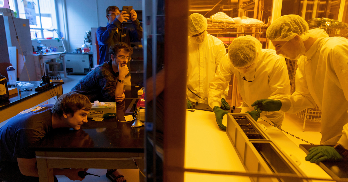 photo of students working in the small satellite research lab