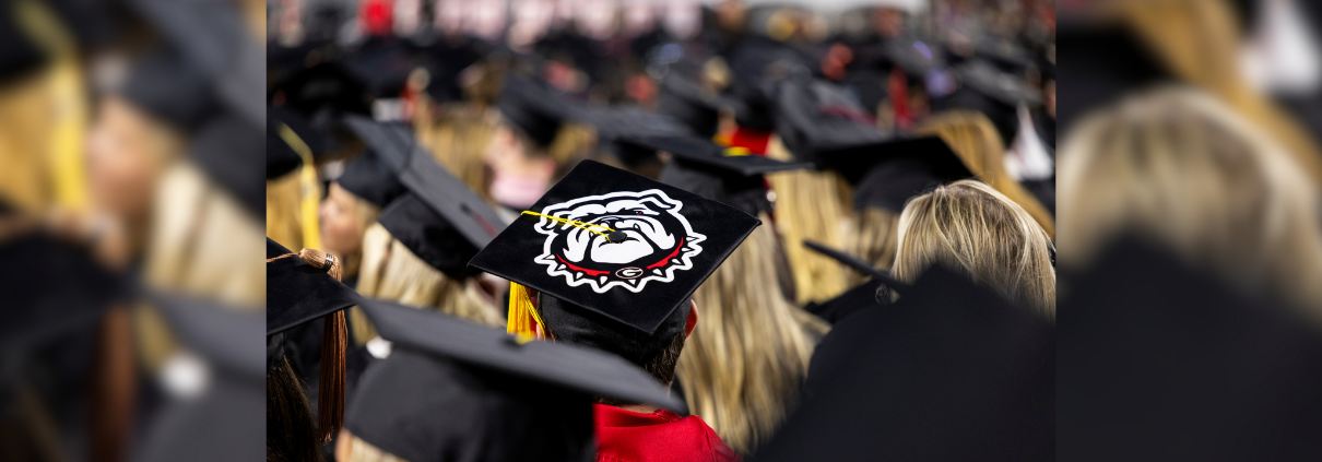 A Bulldog design is featured on a graduation cap.