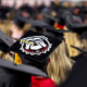 A Bulldog design is featured on a graduation cap.
