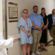 Cassidy Head is picture in a hallway with rural health care workers during her internship with the UGA Archway Partnership.