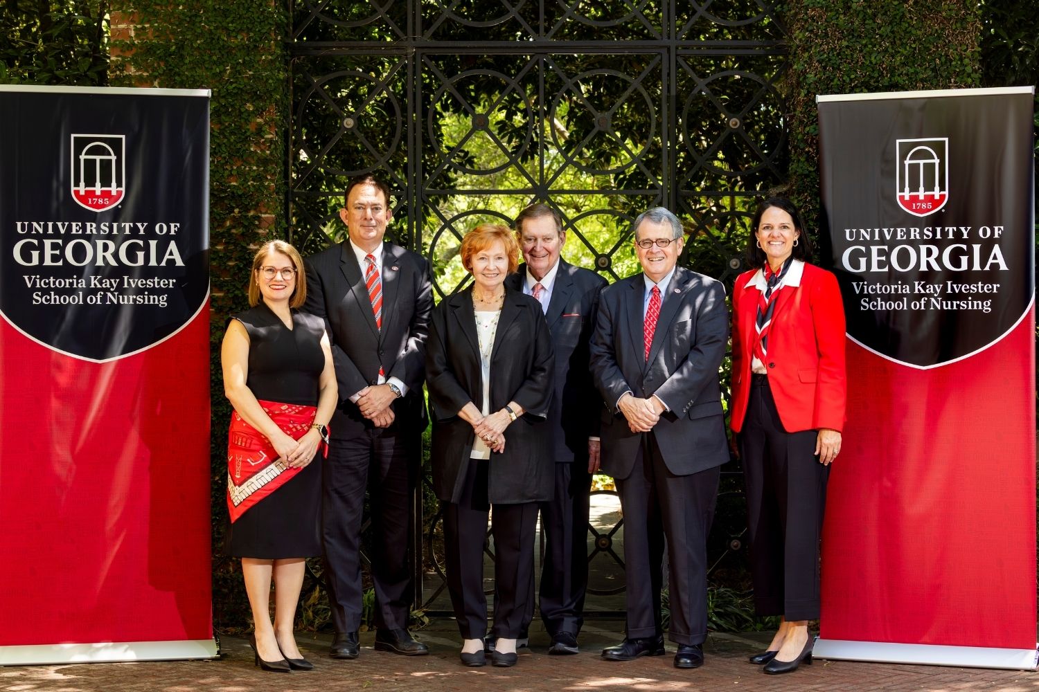 Group posing for a photo during the Victoria Kay Ivester School of Nursing event.