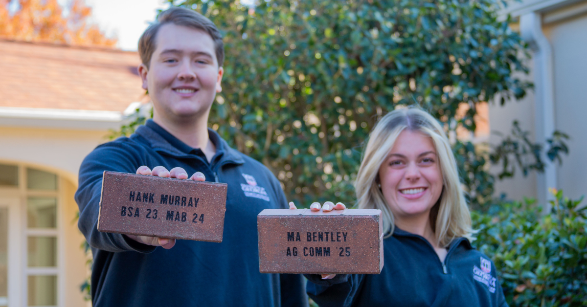 photo of students with bricks