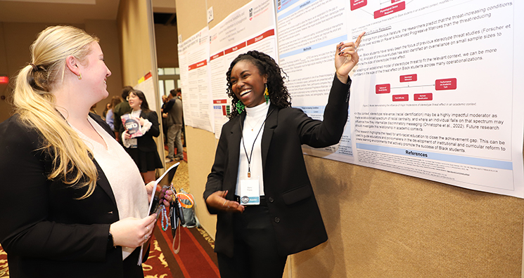 two students at CURO presentation