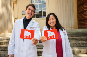 Photo of CVM students in their white coats