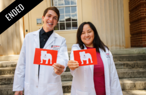 Photo of CVM students in their white coats