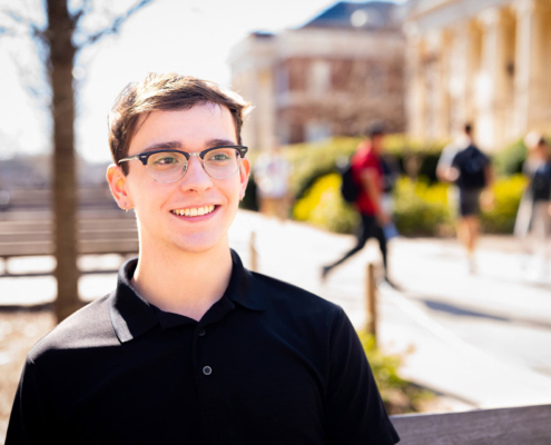 Colby Smith, recipient of a UGA need-based scholarship, outside of Brooks Hall