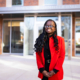 Fatime Niane, recipient of a UGA need-based scholarship, in front of Black-Diallo-Miller Hall