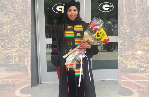 Dr. Gadson post-graduation with flowers