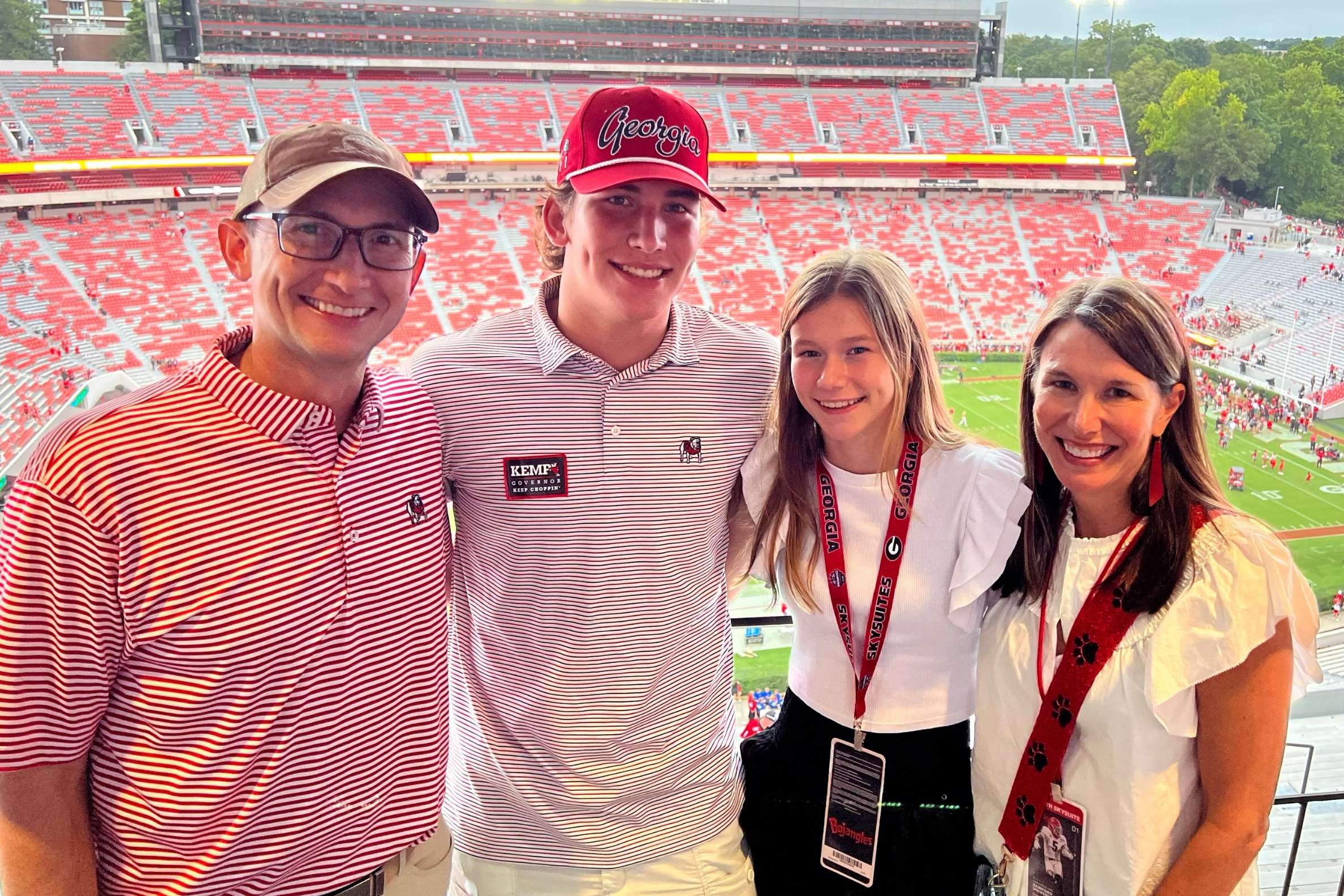 Parker and Kelly with their son, Crawford (second from left), and daughter, Caddie (second from right), pictured at a UGA football game.