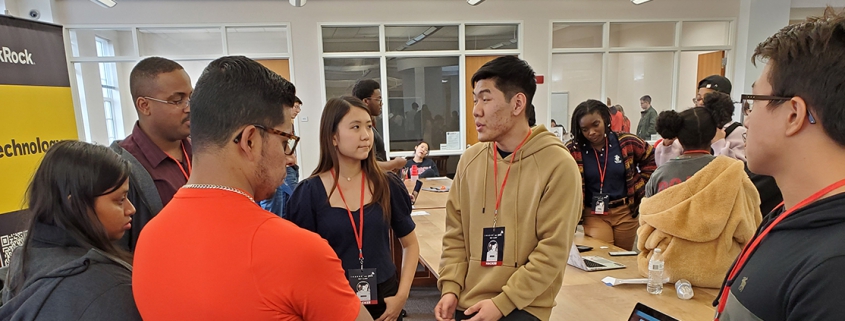 Students speak with representatives from BlackRock at the Miller Learning Center in February