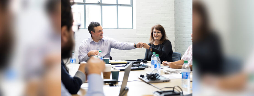 (L-R) Entrepreneurs David Fonteno and Scott Edwards talk with UGA faculty member Dee Warmath and UGA students Aries Aviles and Calvin Butson inside the Delta Innovation Hub, which will house the activities of the Truist Community Innovation Initiative. (credit: Andrew Davis Tucker)