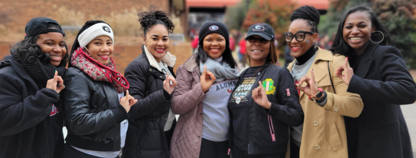 AKA alumnae celebrate the UGA national championship in front of the UGA Bookstore