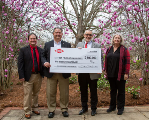 Standing with a ceremonial check to commemorate Orkin's $500,000 commitment to create a professorship in entomology are Dan Suiter, Orkin Professor of Urban Entomology and UGA Extension entomologist; Freeman Elliott, recently retired Orkin president and member of the CAES Advisory Council; Nick Place, CAES dean and director; and Kris Braman, professor and head of the CAES Department of Entomology. (photo: Lavi Astacio)