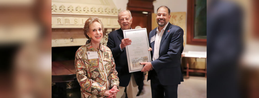 UGA Librarian and Associate Provost Toby Graham (right) presents the Dooley Friends of the UGA Libraries Award to Diana and Craig Barrow.