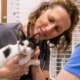 UGA College of Veterinary shelter medicine specialist Dr. Staci Cannon and then-4th year veterinary student Helen Jones check on a cat who recently had surgery while volunteering at the Athens Area Humane Society in 2022.