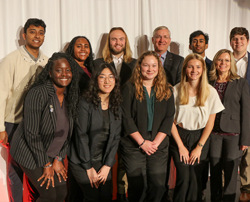 Stuart Countess, president and CEO of Kia Georgia Inc., (back row, third from right) and April Bartley, external affairs manager for Kia Georgia Inc., (front row, far right) met with UGA Engineering students during the 2024 UGA Electric Mobility Summit at the Classic Center in Athens.