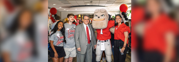 UGA President Jere W. Morehead (center) and Jill Walton, vice president for development and alumni relations, (right) join students and Hairy Dawg at the Tate Student Center for a Dawg Day of Giving event on March 27. (PHOTO: Edwin Hammond)