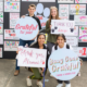 students holding posters