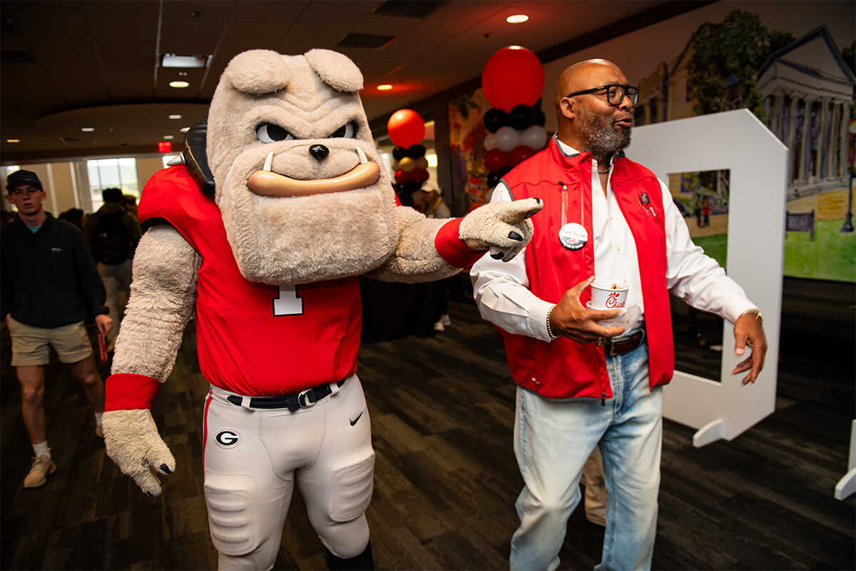 Hairy Dawg and Chuck Kinnebrew, UGA Alumni Association board member, joined the Dawg Day of Giving event at Tate Student Center on March 26. PHOTO: Justin Evans