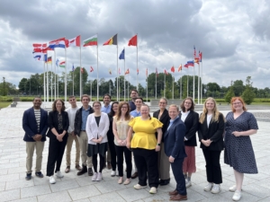 Global Externship students pose in front of a NATO building