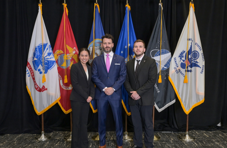 OSA FY26 SVRC Georgia Funder(2) Student veterans pose in front of US Military flags