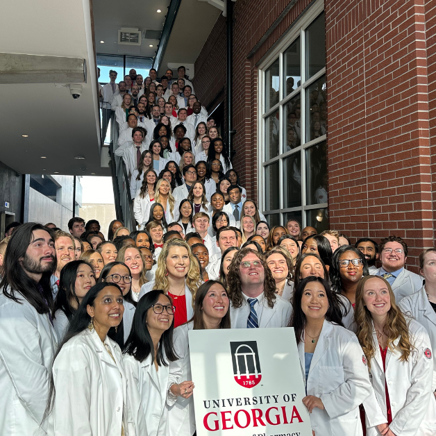 white coat ceremony picture on stairs 