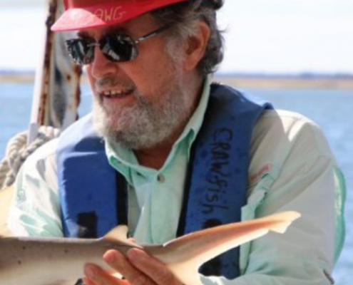 John "Crawfish" Crawford holds up a bonnethead shark on the R/V Sea Dawg