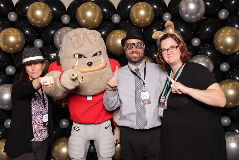 Staff posing with Hairy Dawg