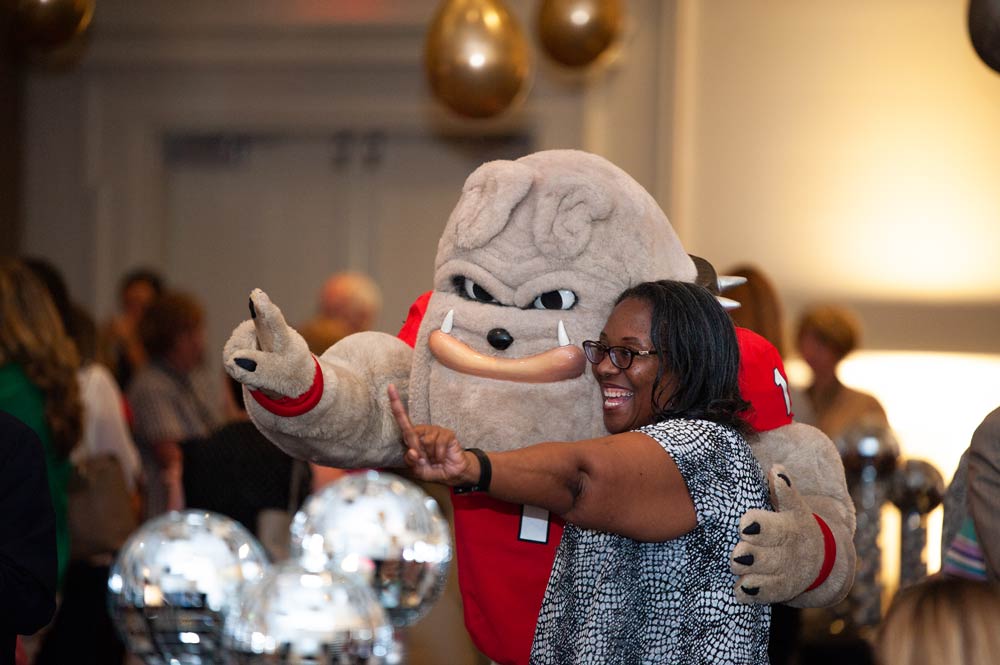 staff member posing with hairy dawg